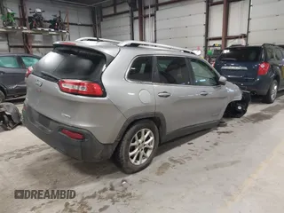 2016 Jeep Cherokee Altitude with VIN 1C4PJMCB6GW295404, listed as a IAAI auction lot 41211758 with 100,722 mi miles and . Bid and sale history available at DreamBid. Image 4.