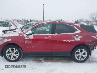 2021 Chevrolet Equinox Premier z VIN 2GNAXXEV4M6105996, wystawiony jako IAAI lot #41402065 z przebiegiem 51 083 mil mil oraz . Historia ofert i sprzedaży dostępna na DreamBid. Obrazek 15.