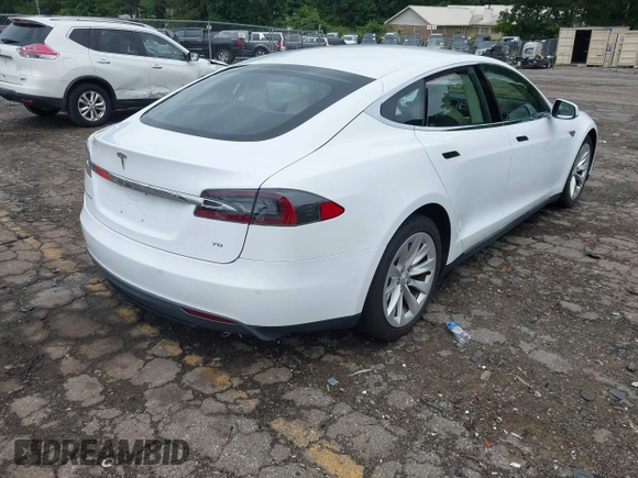 2016 Tesla Model S 70 with VIN 5YJSA1E11GF132984, listed as a IAAI auction lot 42428634 with Not provided miles and . Bid and sale history available at DreamBid. Image 4.