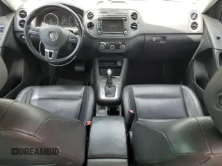 2012 Volkswagen Tiguan SE z VIN WVGAV7AX4CW001417, wystawiony jako Copart lot #61105865 z przebiegiem 168 110 mil mil oraz Czysty tytuł • Clean title. Historia ofert i sprzedaży dostępna na DreamBid. Obrazek 8.