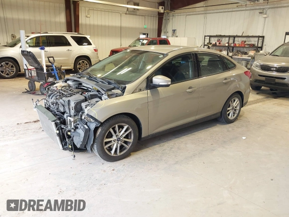 2016 Ford Focus SE z VIN 1FADP3F23GL277537, wystawiony jako IAAI lot #41603658 z przebiegiem 107 115 mil mil oraz . Historia ofert i sprzedaży dostępna na DreamBid. Obrazek 2.