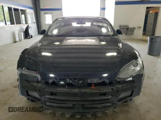 2014 Tesla Model S 60 with VIN 5YJSA1H10EFP52850, listed as a Copart auction lot 54321805 with 58,031 mi miles and Salvage Title. Bid and sale history available at DreamBid. Image 5.