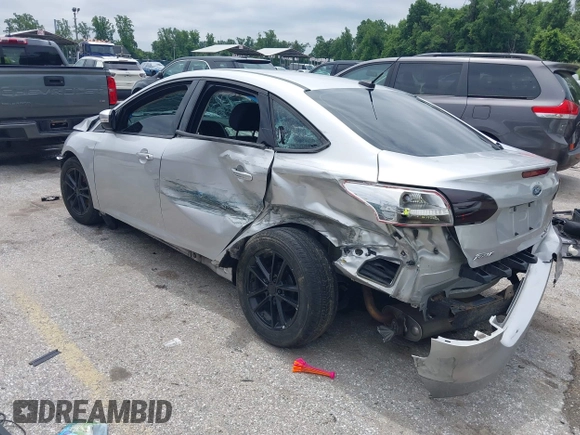 2016 Ford Focus SE z VIN 1FADP3F22GL373756, wystawiony jako IAAI lot #42369795 z przebiegiem 99 646 mil mil oraz . Historia ofert i sprzedaży dostępna na DreamBid. Obrazek 3.