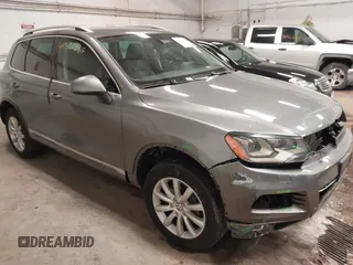 2011 Volkswagen Touareg Sport with VIN WVGFF9BP6BD000938, listed as a IAAI auction lot 41557569 with 158,608 mi miles and . Bid and sale history available at DreamBid. Image 1.