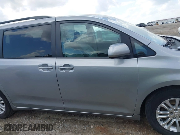 2015 Toyota Sienna XLE with VIN 5TDYK3DC7FS659864, listed as a IAAI auction lot 41958112 with 121,257 mi miles and . Bid and sale history available at DreamBid. Image 13.