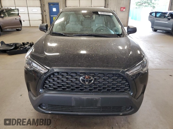 2023 Toyota Corolla Cross L with VIN 7MUAAABG8PV049431, listed as a Copart auction lot 56982055 with 20,275 mi miles and Salvage title. Bid and sale history available at DreamBid. Image 5.