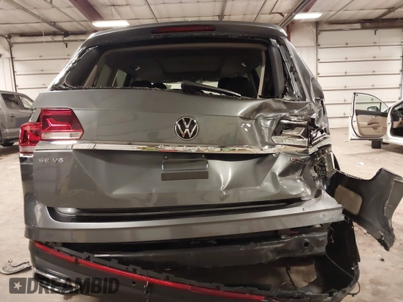 2021 Volkswagen Atlas SE z VIN 1V2KR2CA5MC606590, wystawiony jako IAAI lot #42383813 z przebiegiem 45 087 mil mil oraz . Historia ofert i sprzedaży dostępna na DreamBid. Obrazek 6.