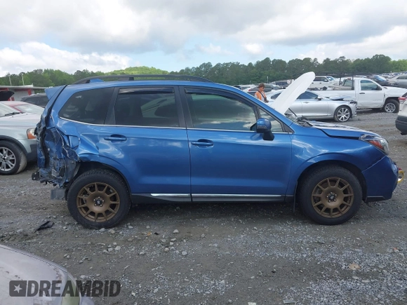 2017 Subaru Forester Touring with VIN JF2SJGWC2HH467144, listed as a IAAI auction lot 42319496 with 122,845 mi miles and . Bid and sale history available at DreamBid. Image 13.