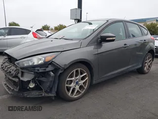 2015 Ford Focus SE with VIN 1FADP3K27FL387012, listed as a IAAI auction lot 42100945 with 85,588 mi miles. Bid and sale history available at carsss.com. Image 2.