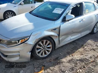 2016 Kia Optima LX with VIN 5XXGT4L35GG059931, listed as a IAAI auction lot 40995180 with 130,596 mi miles. Bid and sale history available at carsss.com. Image 6.