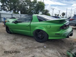 2001 Pontiac Firebird Formula z VIN 2G2FV22G412115819, wystawiony jako Copart lot #70310714 z przebiegiem 203 067 mil mil oraz Szkody całkowita. Historia ofert i sprzedaży dostępna na DreamBid. Obrazek 2.