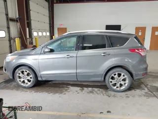 2014 Ford Escape Titanium with VIN 1FMCU9J90EUC31625, listed as a IAAI auction lot 41492075 with 301,917 mi miles and . Bid and sale history available at DreamBid. Image 14.
