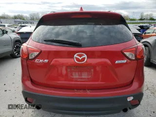 2014 Mazda CX-5 Touring with VIN JM3KE2CY6E0316041, listed as a Copart auction lot 52227835 with 69,921 mi miles and Salvage Title. Bid and sale history available at DreamBid. Image 6.