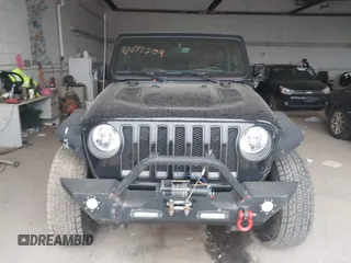 2021 Jeep Wrangler Unlimited Rubicon with VIN 1C4HJXFN2MW587168, listed as a IAAI auction lot 42472309 with 66,272 mi miles and . Bid and sale history available at DreamBid. Image 12.