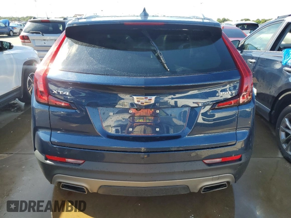 2021 Cadillac XT4 FWD Premium Luxury z VIN 1GYFZCR48MF056210, wystawiony jako Copart lot #73706384 z przebiegiem Nie podano mil oraz Nie do naprawy • Non repairable. Historia ofert i sprzedaży dostępna na DreamBid. Obrazek 6.