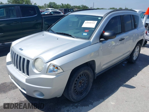 2008 Jeep Compass Sport with VIN 1J8FT47048D767281, listed as a IAAI auction lot 42010343 with 164,734 mi miles. Bid and sale history available at carsss.com. Image 2.