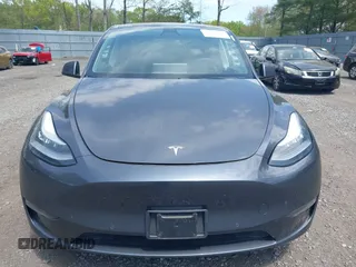 2020 Tesla Model Y Long Range with VIN 5YJYGDEE2LF029385, listed as a IAAI auction lot 42164786 with 58,685 mi miles and . Bid and sale history available at DreamBid. Image 12.