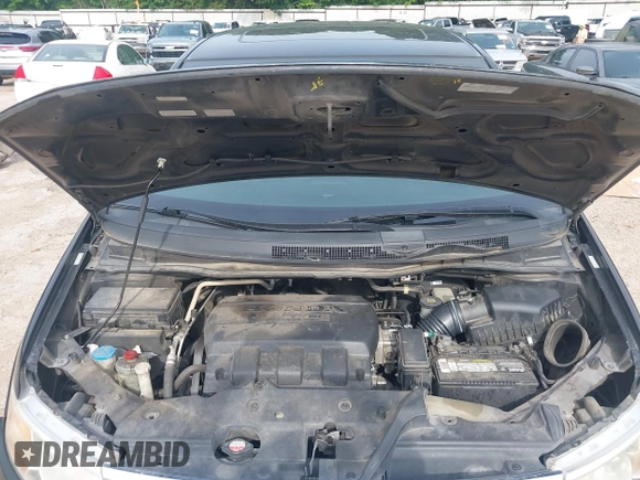 2011 Honda Odyssey Touring with VIN 5FNRL5H90BB070472, listed as a IAAI auction lot 42367710 with 203,589 mi miles and . Bid and sale history available at DreamBid. Image 10.
