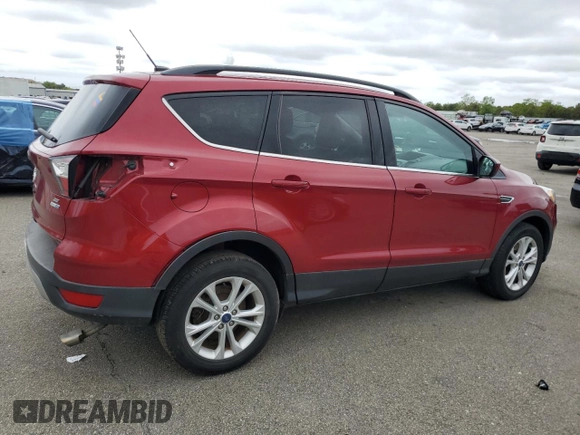 2018 Ford Escape SE z VIN 1FMCU9GD7JUB01668, wystawiony jako Copart lot #57038675 z przebiegiem 70 780 mil mil oraz Szkoda całkowita • Salvage title. Historia ofert i sprzedaży dostępna na DreamBid. Obrazek 3.