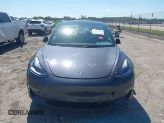 2023 Tesla Model 3 with VIN 5YJ3E1EA8PF626235, listed as a IAAI auction lot 42022893 with 30,333 mi miles and . Bid and sale history available at DreamBid. Image 13.