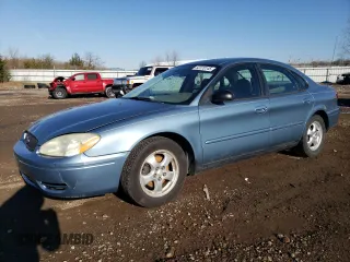 2005 Ford Taurus SE z VIN 1FAFP53205A124597, wystawiony jako Copart lot #56329925 z przebiegiem 136 730 mil mil oraz Szkoda całkowita • Salvage title. Historia ofert i sprzedaży dostępna na DreamBid. Obrazek 1.