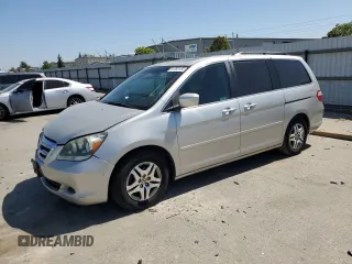 2005 Honda Odyssey EX-L with VIN 5FNRL38785B118162, listed as a Copart auction lot 61283165 with 175,577 mi miles and Salvage title. Bid and sale history available at DreamBid. Image 1.
