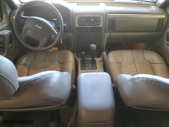 2001 Jeep Grand Cherokee Laredo with VIN 1J4GW48N41C557380, listed as a Copart auction lot 74080604 with 58,005 mi miles and Salvage Title. Bid and sale history available at carsss.com. Image 8.