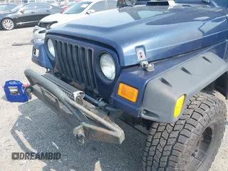 2006 Jeep Wrangler Sport z VIN 1J4FA49S66P708332, wystawiony jako IAAI lot #42402995 z przebiegiem 130 795 mil mil oraz . Historia ofert i sprzedaży dostępna na DreamBid. Obrazek 6.