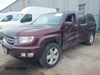 2011 Honda Ridgeline RTL with VIN 5FPYK1F51BB007959, listed as a IAAI auction lot 41894350 with 186,926 mi miles. Bid and sale history available at carsss.com. Image 2.
