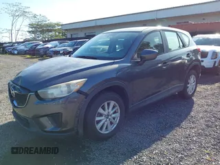 2014 Mazda CX-5 Sport with VIN JM3KE2BE8E0313407, listed as a IAAI auction lot 41215428 with 120,387 mi miles and . Bid and sale history available at carsss.com. Image 21.
