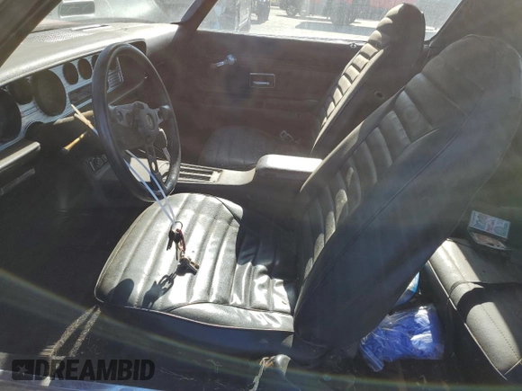 1975 Pontiac Firebird z VIN 2U87S5N582923, wystawiony jako Copart lot #72821784 z przebiegiem 37 718 mil mil oraz Czysty tytuł • Clean title. Historia ofert i sprzedaży dostępna na DreamBid. Obrazek 7.