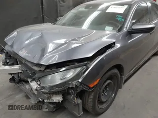 2020 Honda Civic LX with VIN 19XFC2F67LE006057, listed as a IAAI auction lot 42032759 with 119,319 mi miles and . Bid and sale history available at DreamBid. Image 6.