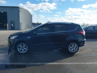 2015 Ford Escape Titanium with VIN 1FMCU0JX8FUC34459, listed as a IAAI auction lot 41394012 with 154,077 mi miles. Bid and sale history available at carsss.com. Image 14.