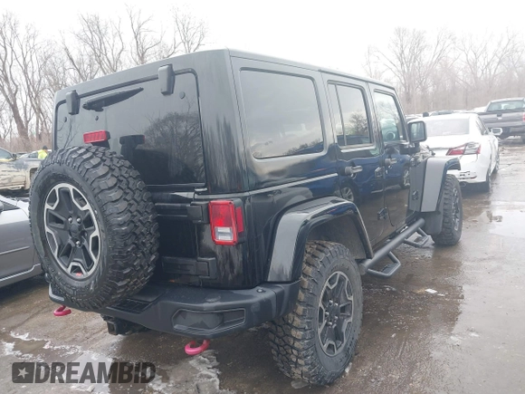 2015 Jeep Wrangler Unlimited Rubicon Hard Rock with VIN 1C4HJWFG9FL569962, listed as a IAAI auction lot 41557801 with 78,597 mi miles and . Bid and sale history available at DreamBid. Image 4.