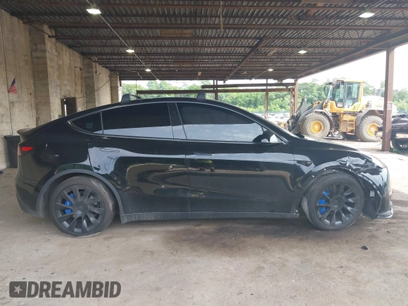 2023 Tesla Model Y Long Range with VIN 7SAYGDEE3PA185778, listed as a IAAI auction lot 39721611 with 11,986 mi miles and . Bid and sale history available at DreamBid. Image 13.