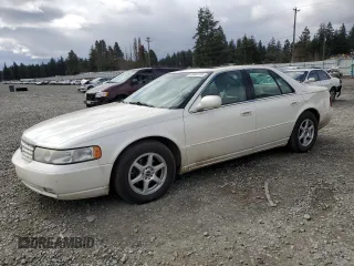 2000 Cadillac Seville Touring STS z VIN 1G6KY5497YU191639, wystawiony jako Copart lot #49658115 z przebiegiem 82 725 mil mil oraz Szkody całkowita. Historia ofert i sprzedaży dostępna na DreamBid. Obrazek 1.