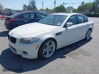 2013 BMW M5 with VIN WBSFV9C58DC773268, listed as a IAAI auction lot 41890830 with 128,399 mi miles. Bid and sale history available at carsss.com. Image 2.