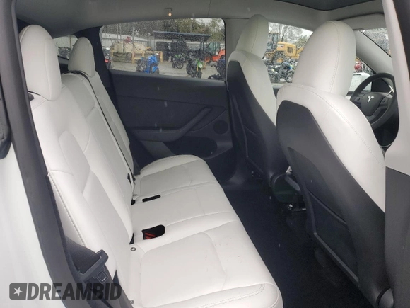 2023 Tesla Model Y Performance with VIN 7SAYGDEF1PF809654, listed as a Copart auction lot 43981915 with 16,401 mi miles and Salvage Title. Bid and sale history available at DreamBid. Image 11.