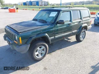 1999 Jeep Cherokee Sport with VIN 1J4FF68SXXL677013, listed as a IAAI auction lot 41993355 with 228,722 mi miles. Bid and sale history available at carsss.com. Image 2.