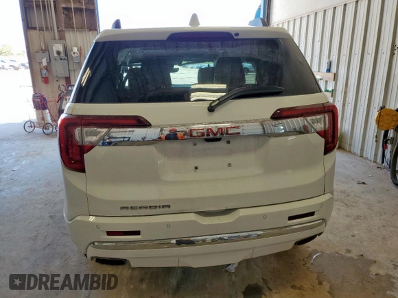 2023 GMC Acadia Denali with VIN 1GKKNPLSXPZ195597, listed as a Copart auction lot 61125815 with 7,564 mi miles and Salvage title. Bid and sale history available at DreamBid. Image 6.