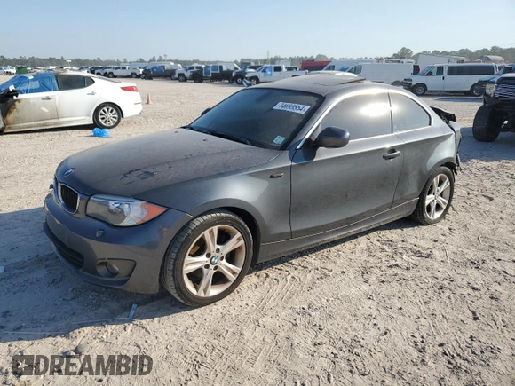 2013 BMW 1 Series 128i with VIN WBAUP7C52DVP24761, listed as a Copart auction lot 74695554 with Not Provided miles and Salvage Title. Bid and sale history available at carsss.com. Image 1.