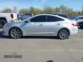 2015 Hyundai Azera z VIN KMHFG4JG0FA453994, wystawiony jako IAAI lot #42002922 z przebiegiem 102 094 mil mil oraz . Historia ofert i sprzedaży dostępna na DreamBid. Obrazek 14.