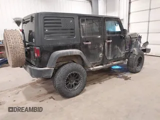 2017 Jeep Wrangler Unlimited Sport with VIN 1C4BJWDGXHL698014, listed as a IAAI auction lot 41384325 with 121,402 mi miles. Bid and sale history available at carsss.com. Image 4.