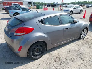 2013 Hyundai Veloster w/Gray Int with VIN KMHTC6AD9DU128725, listed as a IAAI auction lot 42648356 with 168,109 mi miles and . Bid and sale history available at DreamBid. Image 4.