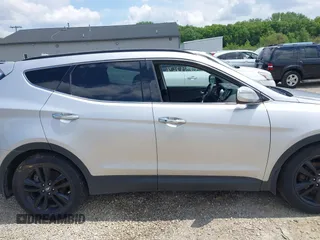 2013 Hyundai Santa Fe Sport z VIN 5XYZUDLA8DG055576, wystawiony jako IAAI lot #42392636 z przebiegiem 165 096 mil mil oraz . Historia ofert i sprzedaży dostępna na DreamBid. Obrazek 13.