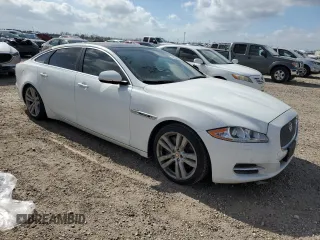 2014 Jaguar XJ with VIN SAJWA2GZ3E8V70365, listed as a Copart auction lot 42545995 with 65,649 mi miles and Salvage Title. Bid and sale history available at carsss.com. Image 4.
