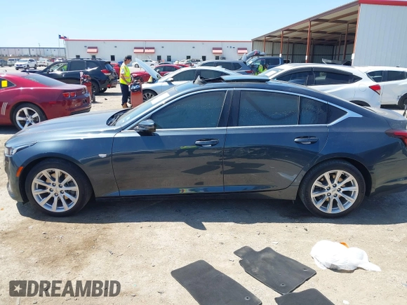 2021 Cadillac CT5 Luxury z VIN 1G6DW5RKXM0144424, wystawiony jako IAAI lot #41985803 z przebiegiem 65 555 mil mil oraz . Historia ofert i sprzedaży dostępna na DreamBid. Obrazek 14.