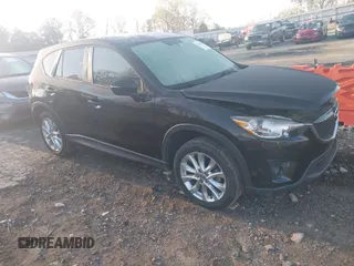 2015 Mazda CX-5 Grand Touring with VIN JM3KE4DY6F0513173, listed as a IAAI auction lot 41867030 with 93,770 mi miles. Bid and sale history available at carsss.com. Image 1.