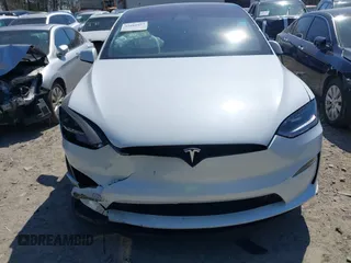 2023 Tesla Model X with VIN 7SAXCDE50PF414198, listed as a IAAI auction lot 41880957 with Not Provided miles and . Bid and sale history available at DreamBid. Image 6.