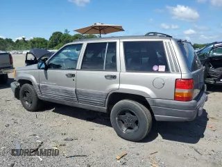 1998 Jeep Grand Cherokee Laredo z VIN 1J4GZ58S4WC278490, wystawiony jako Copart lot #62388535 z przebiegiem 133 896 mil mil oraz Czysty tytuł • Clean title. Historia ofert i sprzedaży dostępna na DreamBid. Obrazek 2.